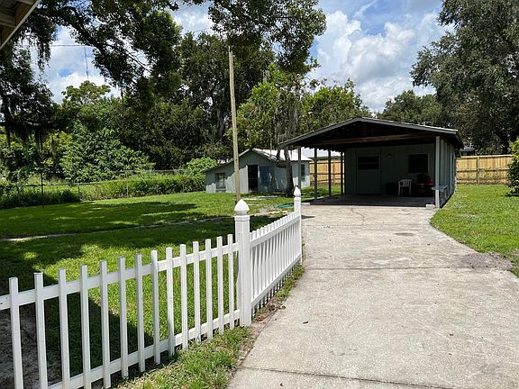 carport/utility room/greenhouse further back