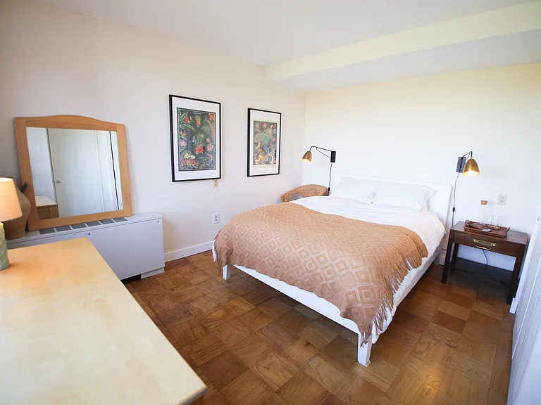 Master bedroom at end of hallway (pictured with queen bed)