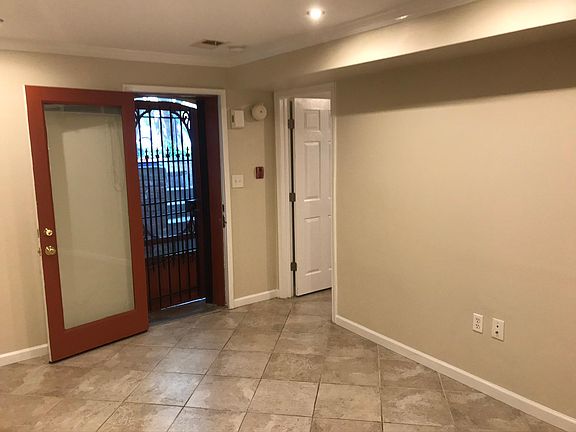 Unit entry door and door to front bedroom
