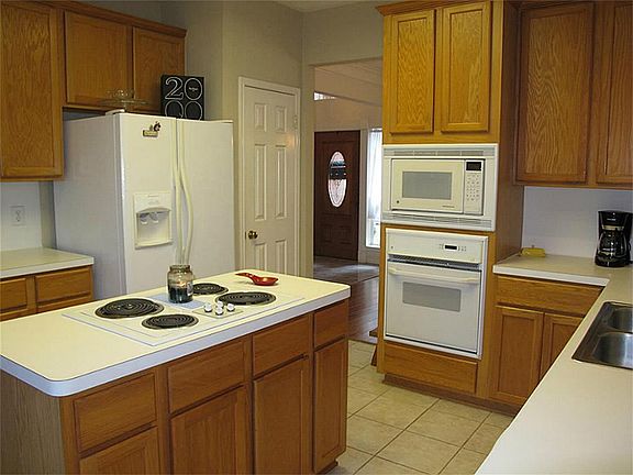Abundant cabinetry and counter space suit all of your kitchen storage and meal preparation needs!