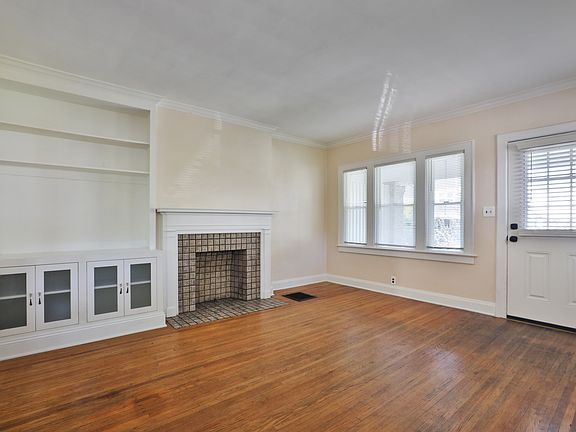 Great custom shelving and decorative fireplace