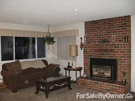Cozy front room and gas fireplace insert
						:
						Carpeted living area and bedrooms. Baths have skylights and linoleum on floors.