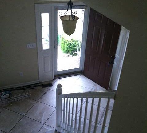 view from stairway to front door