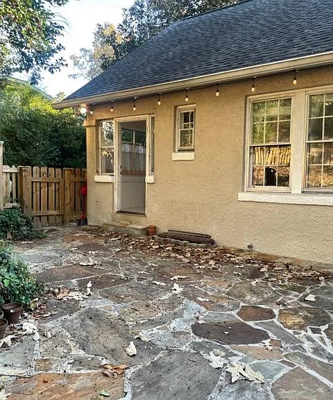 Local flagstones and a fire pit out here.