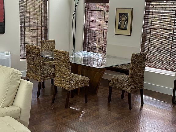 Cypress tree stump base, glass top. Can seat 10 comfortably.