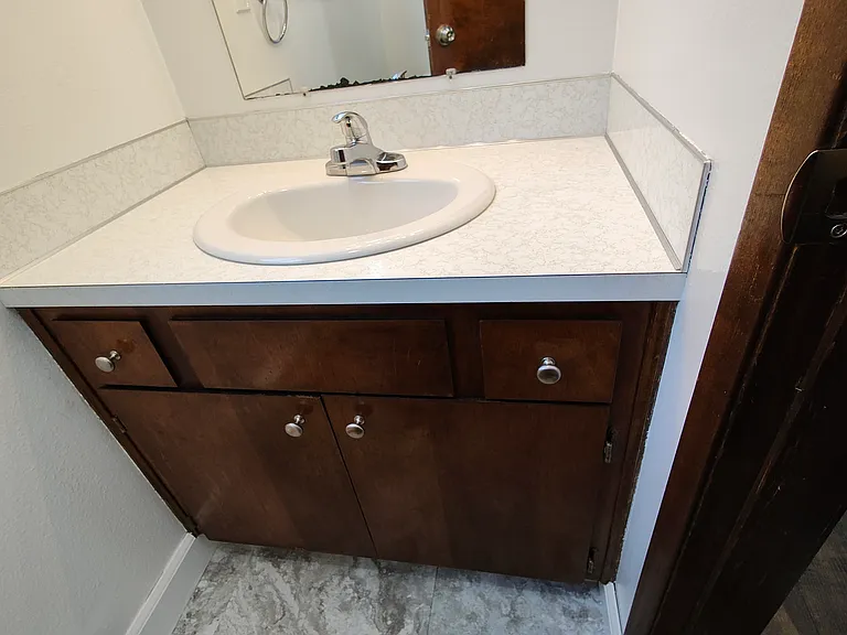 1/2 bath. Located downstairs just off the laundry room.