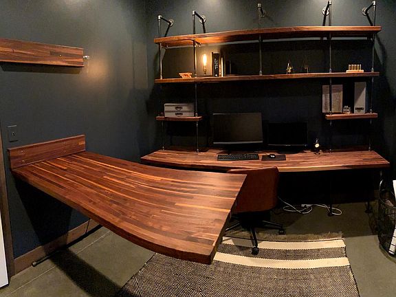 Plan desk folds down off of wall, will accommodate all size blueprints