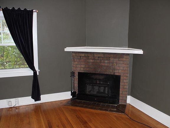 The wood fireplace in the living room with electric heater f