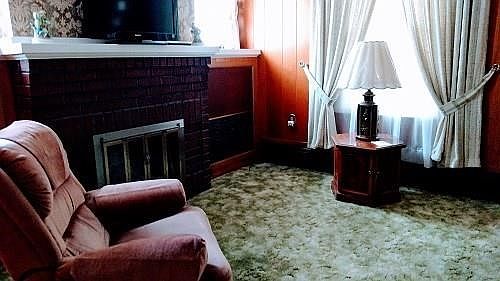 An example of the charm and character found in this home  are the built-in bookcases which flank the deco fireplace in the Livin