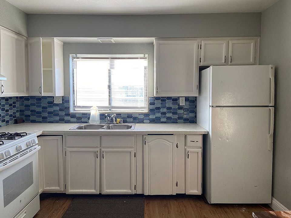 Mosaic Tile Backsplash, quartz countertops & painted cabinets