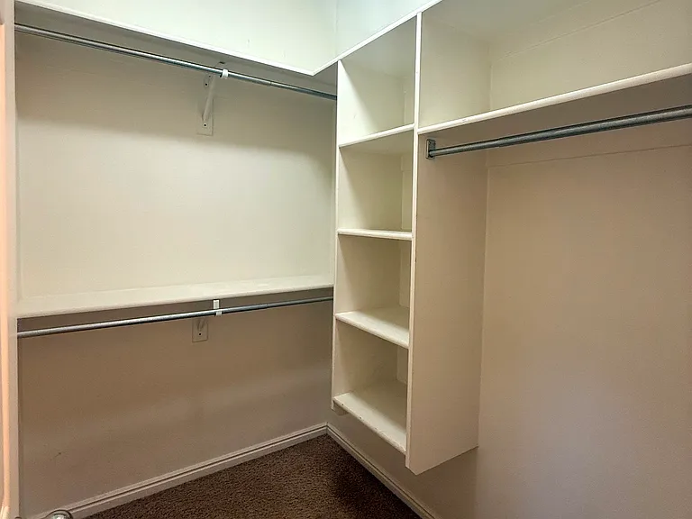 Walk-in closet off of Master Bedroom