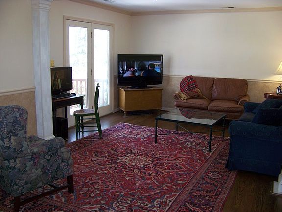 Large family room with french door leading to patio