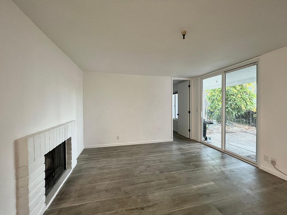 Living room featuring a usable fireplace