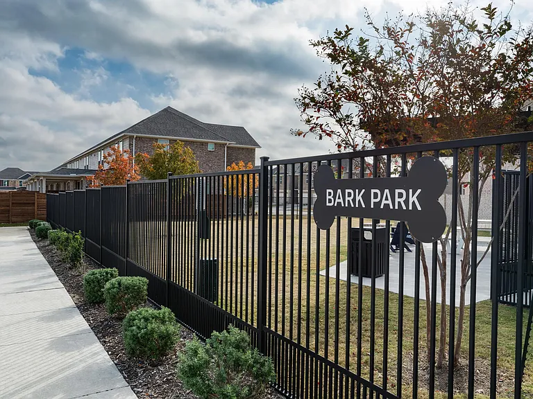 A fenced bark park provides a dedicated space for pets to play, socialize, and enjoy time outdoors close to home.