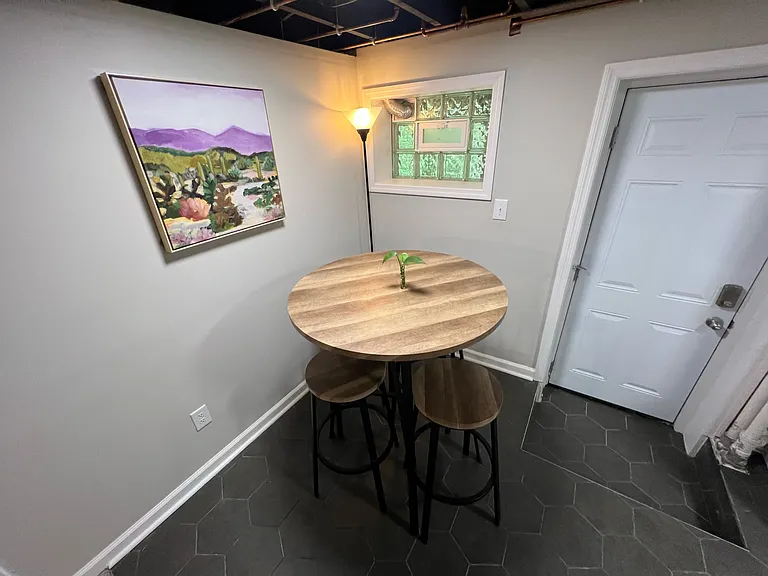 Basement with walkout door leading to patio