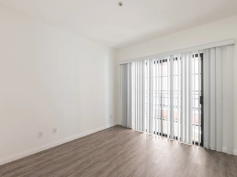 The second bedroom opens onto a private balcony