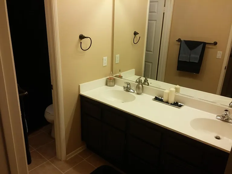 Guest Bathroom w/ private toilet and shower area.