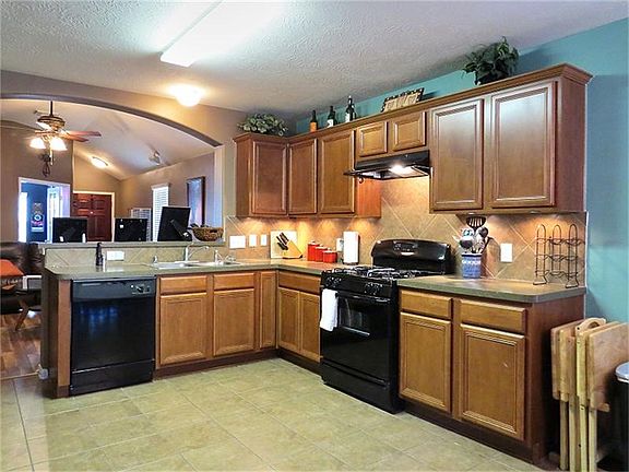 Open kitchen with easy access to family room and...
