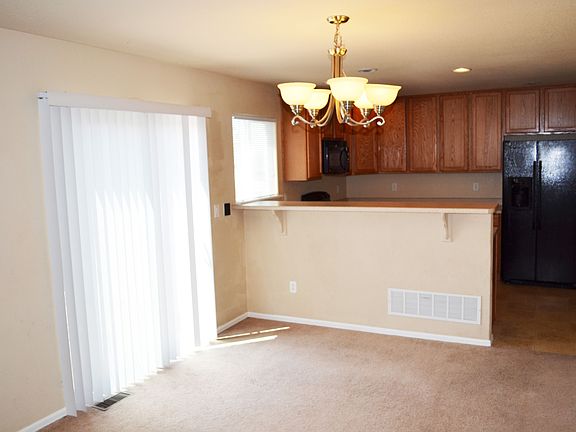 Walk out to the deck or into the kitchen from the spacious living room.