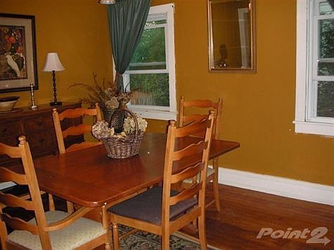 Charming Dining Room features original wood floors
