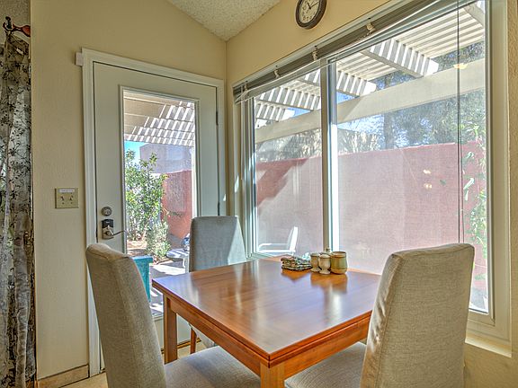 Dining table extends out to seat 6 if you like. Looks out on covered patio.