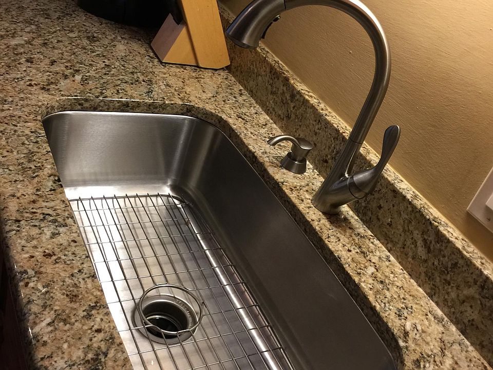 deep large single stainless sink with pull down brushed nickel faucet