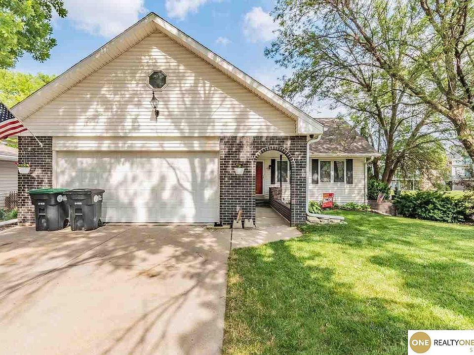 Exterior - Front Yard (Note: Photo is from previous sales listing; Storm-damaged trees were removed in past three years - not reflected in photo)