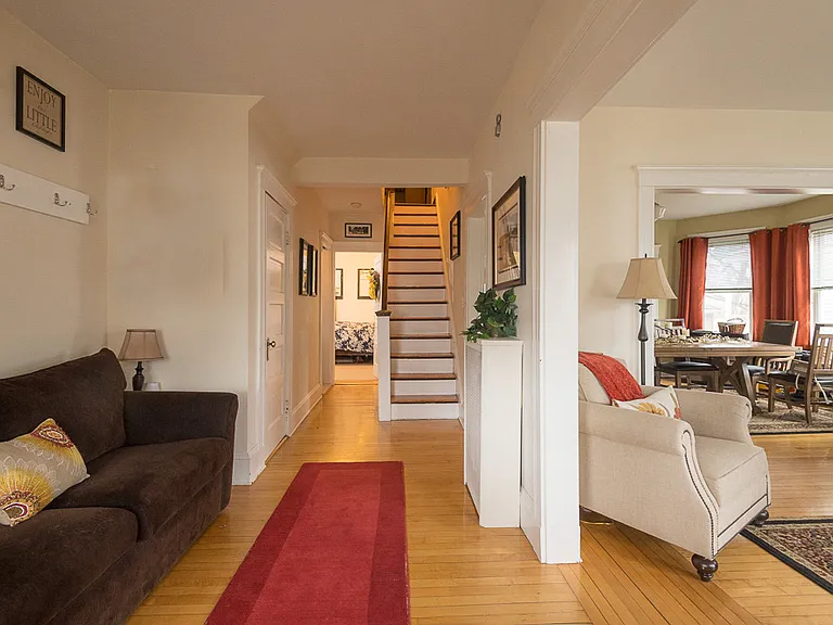 Large Bedroom in back, staircase to two upper bedrooms