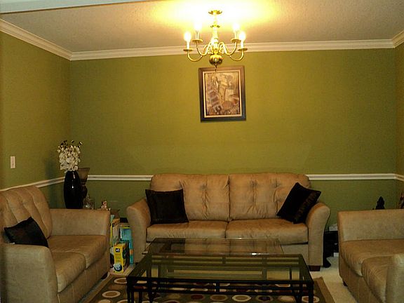 Formal living or dining area with chair rail and crown molding