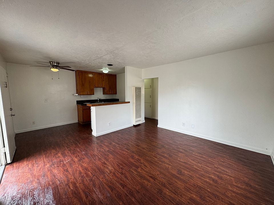 Huge living room with kitchen and eating area. So much space!