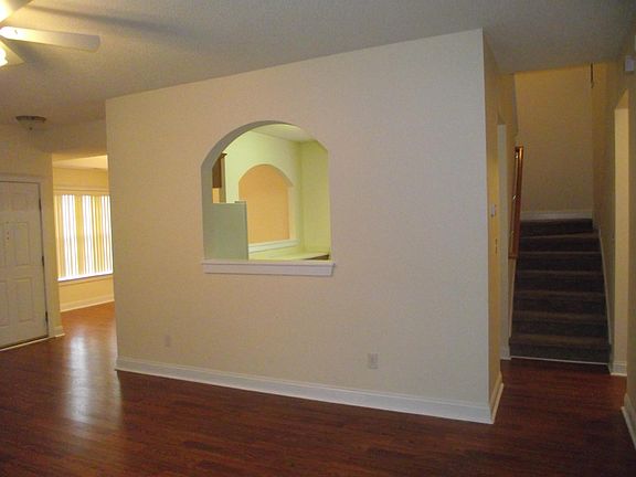 Living Room looking to Dining and stairs