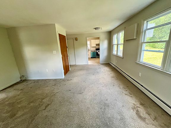 Living room and dining area from the far end look at the kitchen.