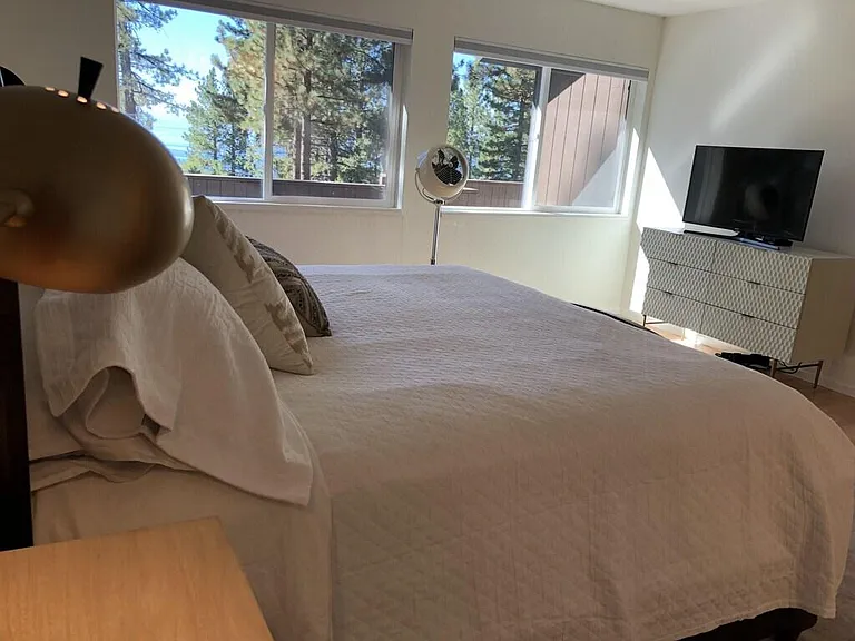 Smart TV in master bedroom with cable and built in apps.