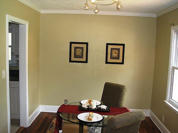 Separate formal dining room off of living room through an encased opening. Cool contemporary light f