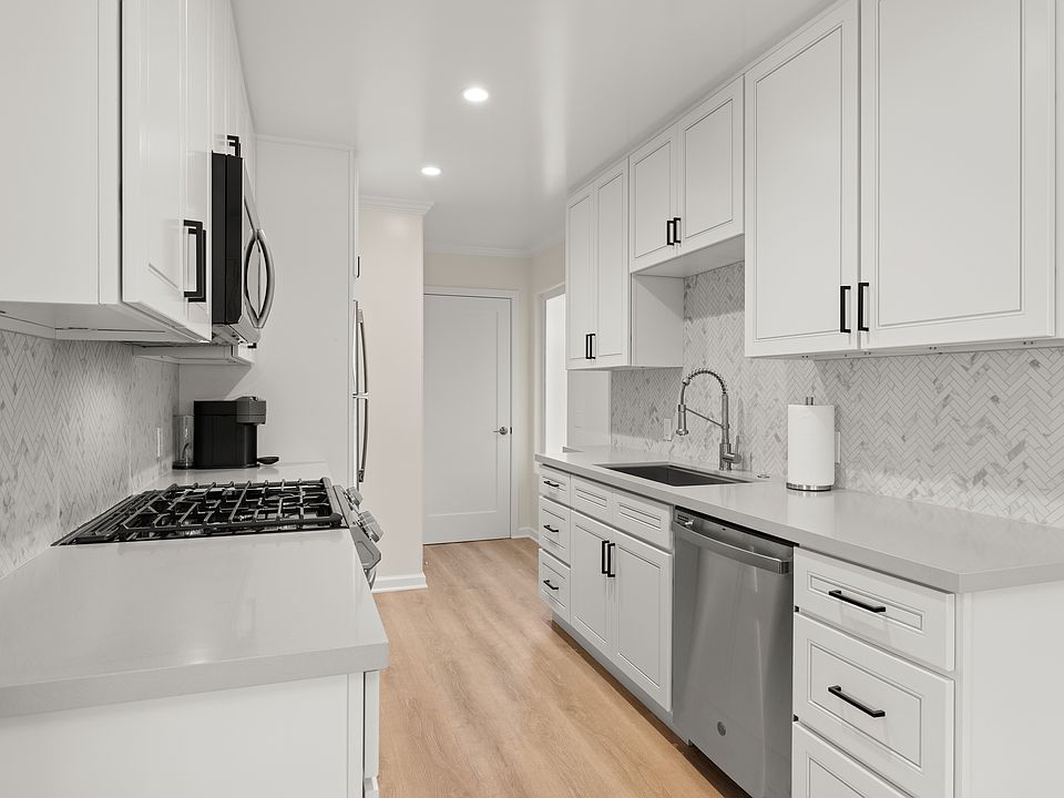 Kitchen with fully stocked kitchen.