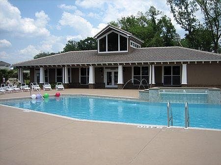 Lounge around Pool with Clubhouse and Gym.