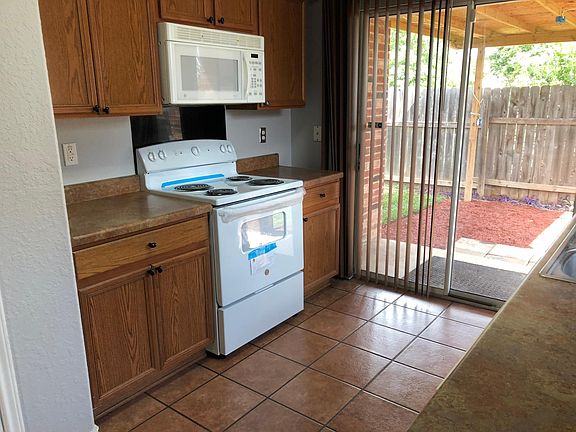 Spacious kitchen leading out to covered patio.