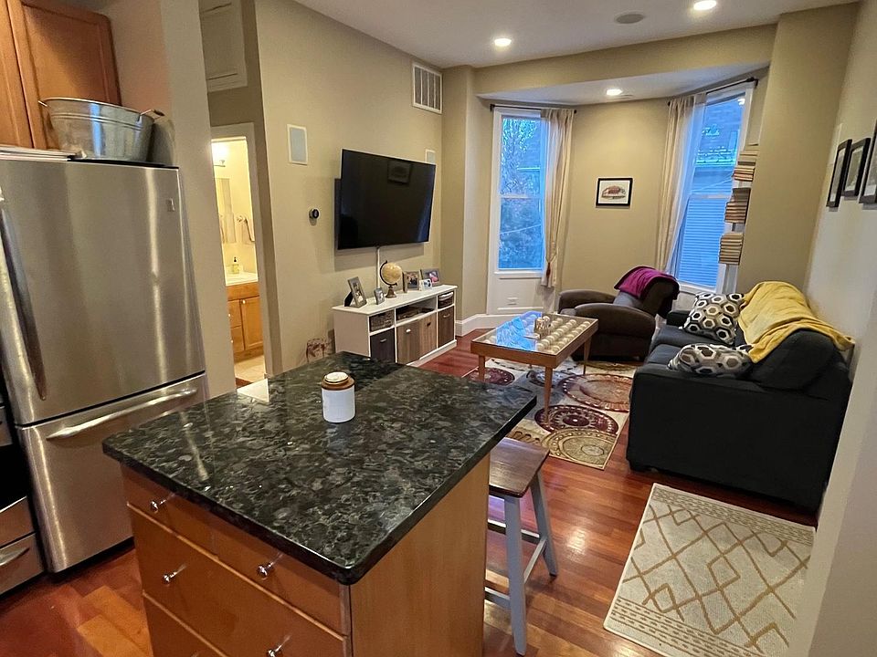 Kitchen counter and living room.