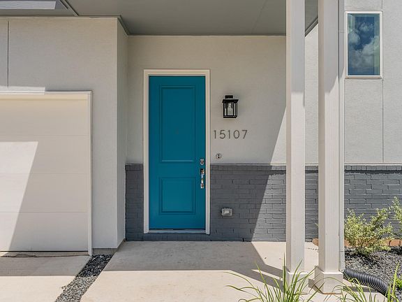 15107 Ryman Rd with a chic blue door welcoming you in!