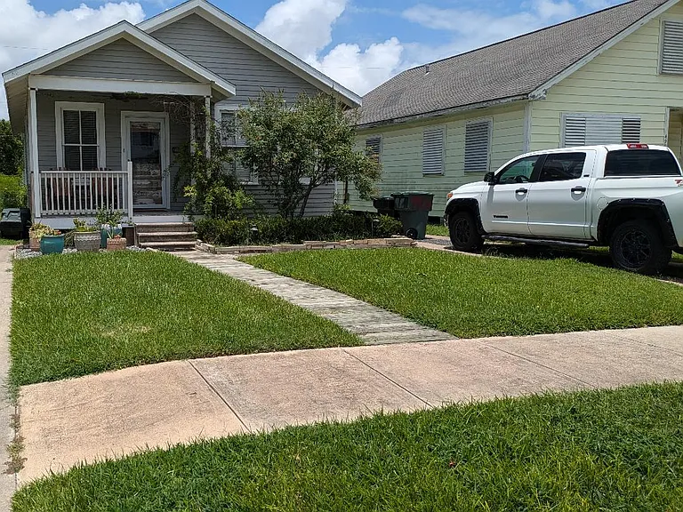 View from Ave R. Driveway provides off street parking for 2 vehicles.
