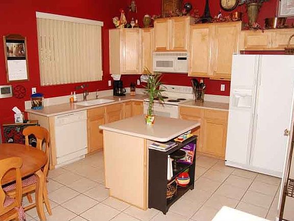 Kitchen includes eat-in, nice appliances, corian counters 