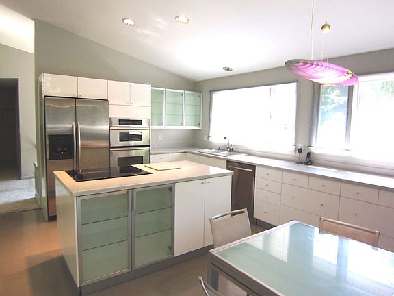 Updated Eat-in Kitchen with Bosch & KitchenAid Appliances and Corian Counters