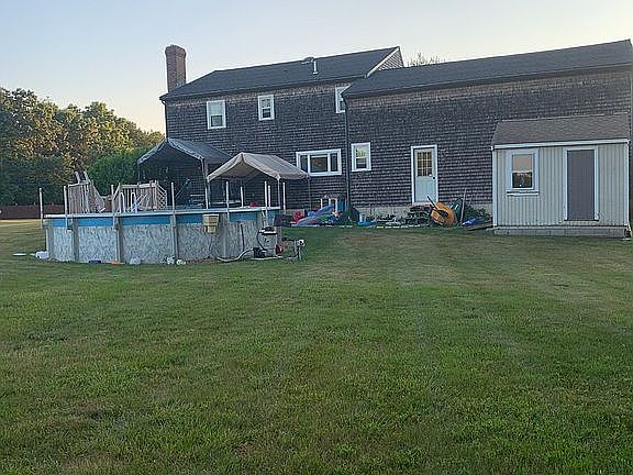 Back yard view pool + shed