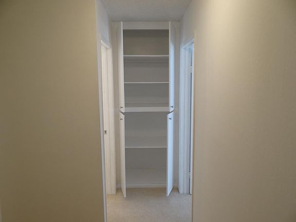 Hall and closet with open doors