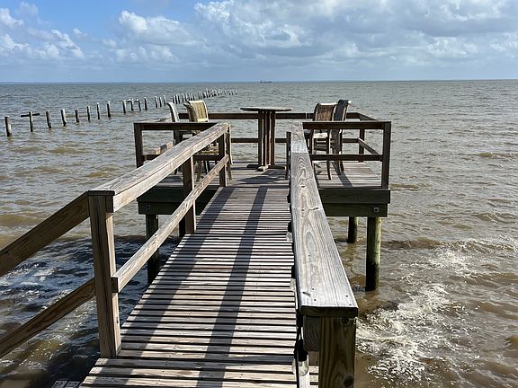 Enjoy the pier and watch cruise ship go by