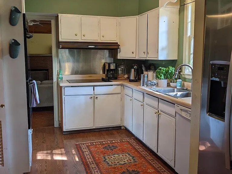 Galley Style Kitchen w black glass stove-top and matching Double Oven