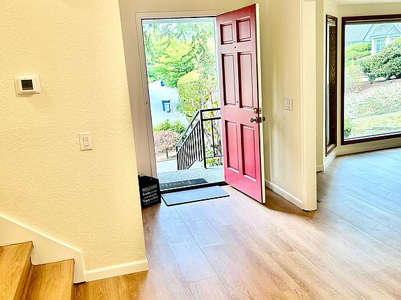 All brand new flooring throughout the foyer and stairs