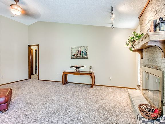 Another angle to show off the size of the living room. The fireplace has gas logs.