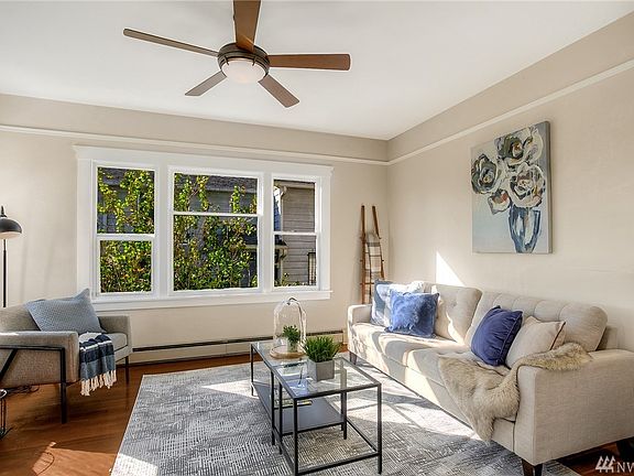 Formal living room has doors that slide shut for cozy fires or private conversation. 