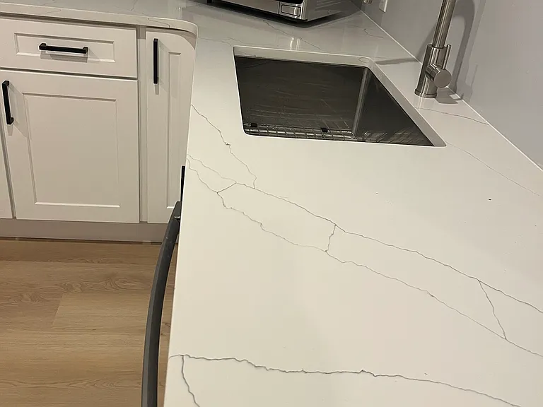 Gorgeous countertops, deep sink and microwave in unit.